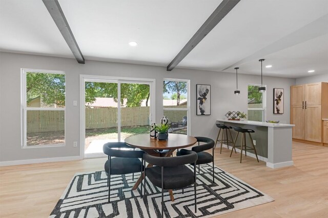 10107 E Rutland Vlg, Austin, TX 78758 - dining area featuring beamed ceiling, light wood-type flooring, plenty of natural light, and recessed lighting
