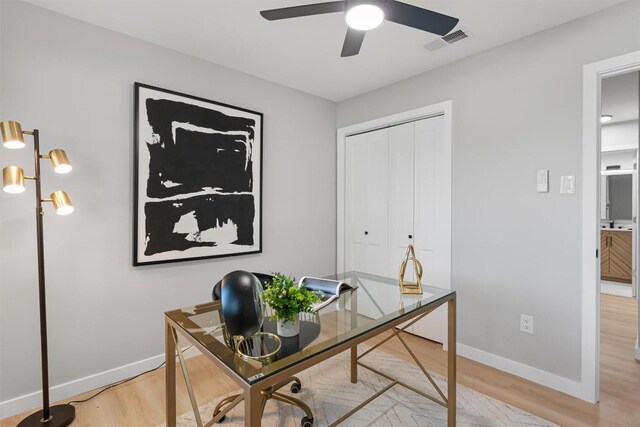 10107 E Rutland Vlg, Austin, TX 78758 - home office with light wood-style flooring and ceiling fan