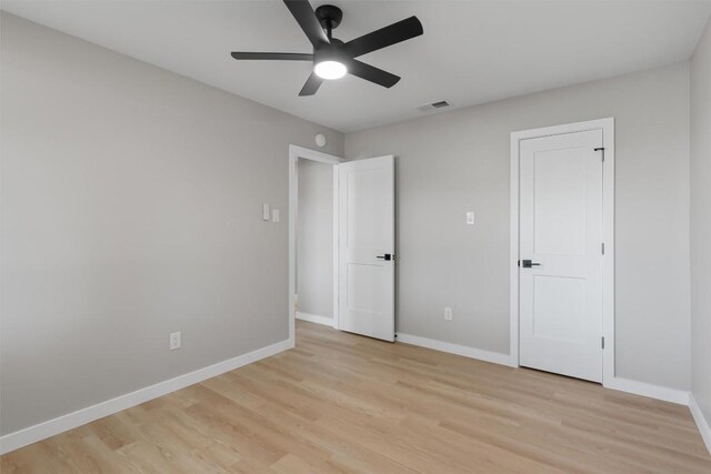 10107 E Rutland Vlg, Austin, TX 78758 - unfurnished bedroom with light wood-style floors and ceiling fan
