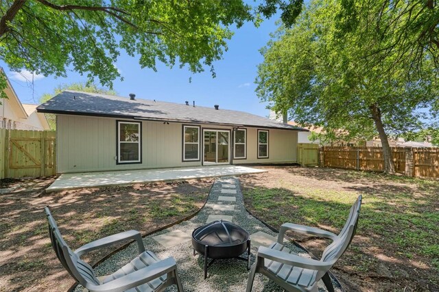 10107 E Rutland Vlg, Austin, TX 78758 - back of house featuring an outdoor fire pit, a patio, and a fenced backyard