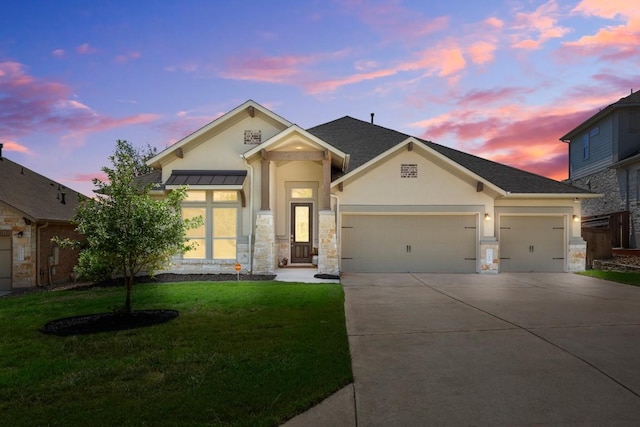 ranch-style house featuring stucco siding, an attached garage, driveway, a lawn, and stone siding