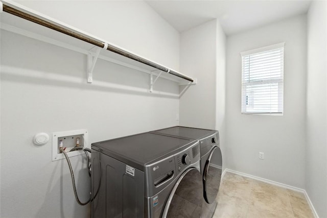 10207 Buster Dr, Austin, TX 78748 - washroom featuring independent washer and dryer and baseboards