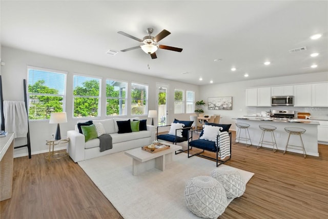 10207 Buster Dr, Austin, TX 78748 - living room featuring light wood-style flooring, recessed lighting, a ceiling fan, and baseboards