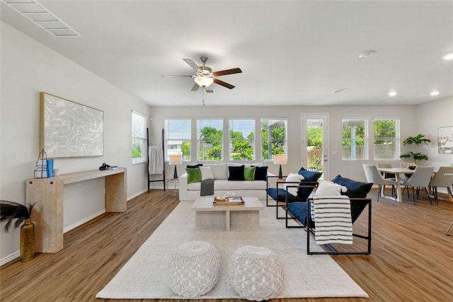 10207 Buster Dr, Austin, TX 78748 - living area with healthy amount of natural light, light wood-style floors, ceiling fan, and recessed lighting