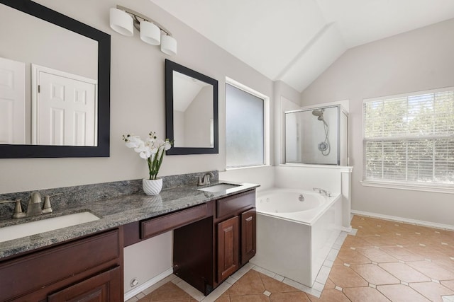 701 Stansted Manor Dr, Pflugerville, TX 78660 - bathroom featuring a shower stall, healthy amount of natural light, a bath, double vanity, and vaulted ceiling