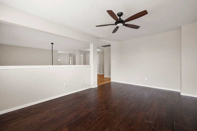 701 Stansted Manor Dr, Pflugerville, TX 78660 - spare room featuring ceiling fan, dark wood-type flooring, and baseboards