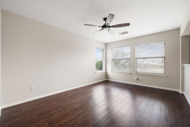 701 Stansted Manor Dr, Pflugerville, TX 78660 - spare room featuring ceiling fan, baseboards, and dark wood-style flooring