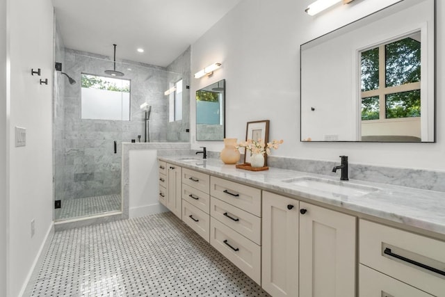 full bathroom featuring a shower stall and double vanity