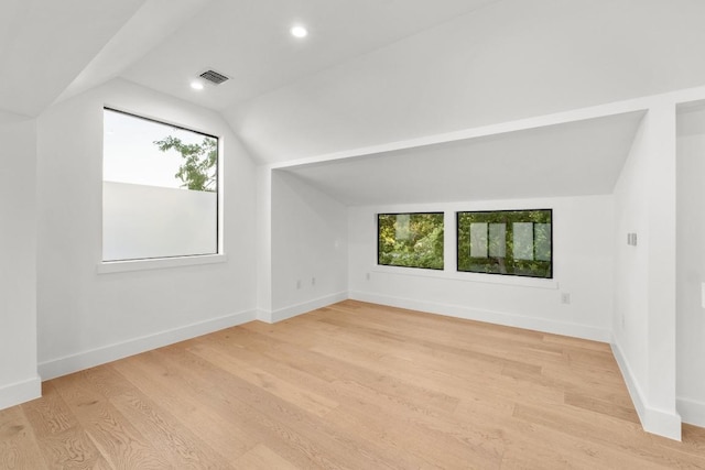 1908 Goodrich Ave Unit B, Austin, TX 78704 - additional living space with vaulted ceiling, healthy amount of natural light, light wood finished floors, baseboards, and recessed lighting