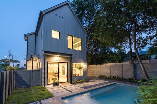 1908 Goodrich Ave Unit B, Austin, TX 78704 - back of property with board and batten siding and a fenced backyard