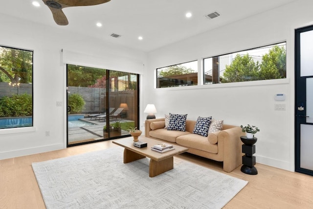 1908 Goodrich Ave Unit B, Austin, TX 78704 - living room featuring light wood-type flooring, recessed lighting, ceiling fan, and baseboards