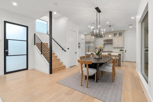 1908 Goodrich Ave Unit B, Austin, TX 78704 - dining space with light wood-type flooring, stairway, a chandelier, recessed lighting, and baseboards