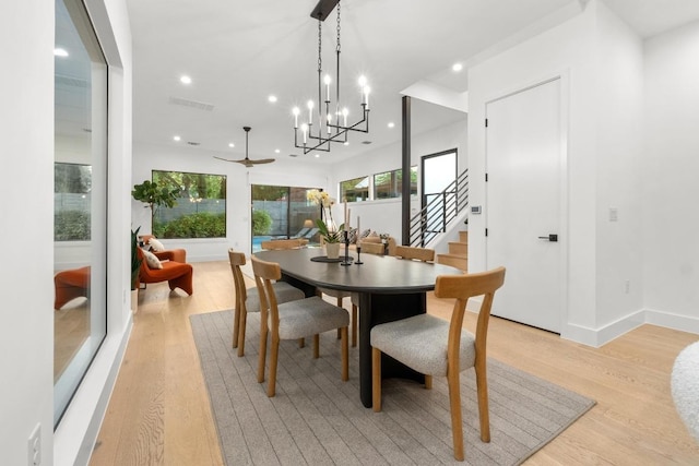 dining area featuring light wood finished floors, stairway, recessed lighting, baseboards, and a ceiling fan