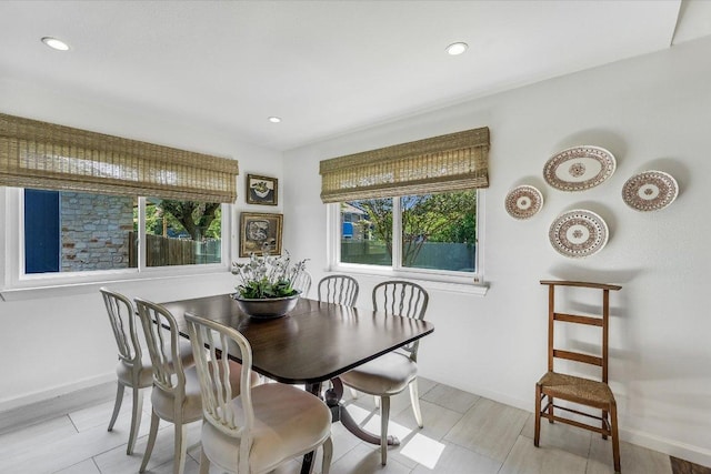 dining area featuring healthy amount of natural light, recessed lighting, and baseboards