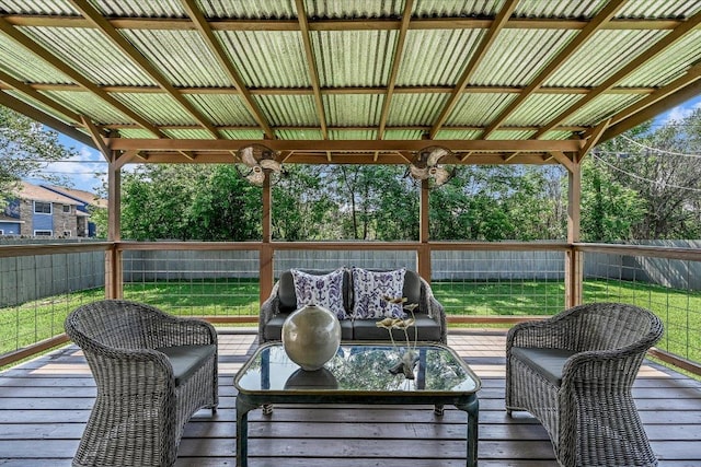 wooden terrace with an outdoor hangout area