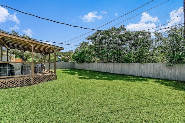 view of yard with a wooden deck