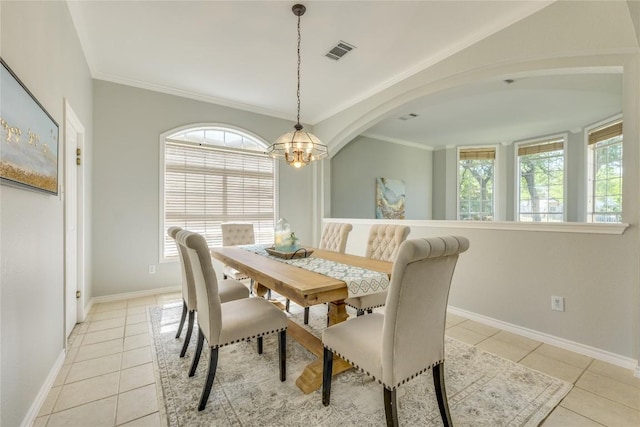 5133 Valburn Ct, Austin, TX 78731 - dining area featuring light tile patterned floors, a chandelier, and ornamental molding