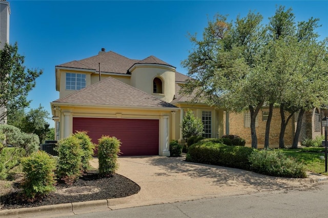 5133 Valburn Ct, Austin, TX 78731 - view of front of house with a garage, stucco siding, driveway, and a shingled roof