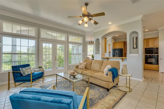5133 Valburn Ct, Austin, TX 78731 - living room with french doors, light tile patterned floors, recessed lighting, arched walkways, and a ceiling fan