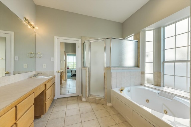 5133 Valburn Ct, Austin, TX 78731 - ensuite bathroom featuring vanity, a tub with jets, a stall shower, and tile patterned flooring