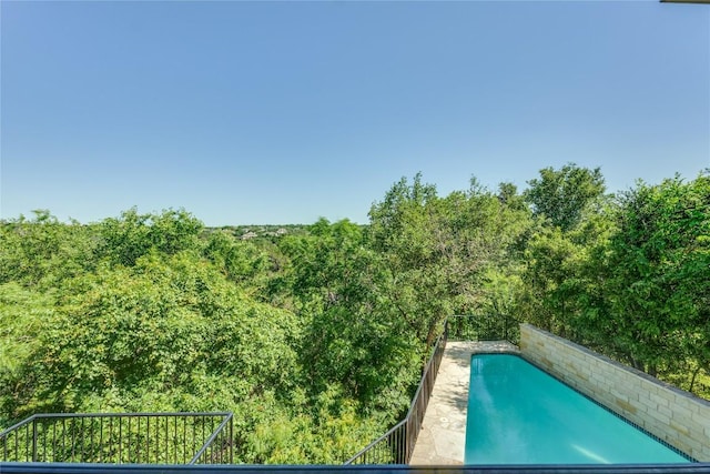 5133 Valburn Ct, Austin, TX 78731 - outdoor pool with a wooded view