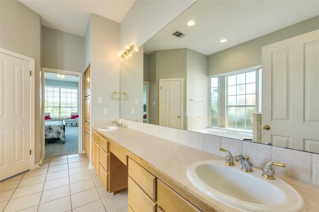 5133 Valburn Ct, Austin, TX 78731 - ensuite bathroom with double vanity, tile patterned floors, and recessed lighting