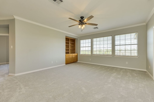 5133 Valburn Ct, Austin, TX 78731 - spare room featuring ornamental molding, a ceiling fan, light carpet, and built in shelves