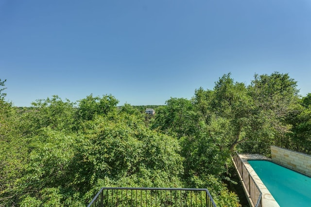 5133 Valburn Ct, Austin, TX 78731 - view of swimming pool with a forest view
