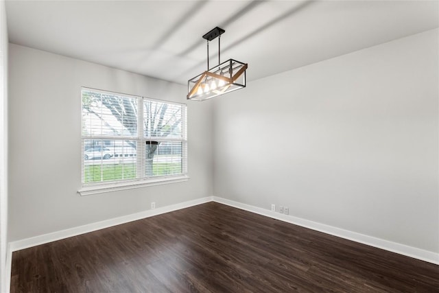 1600 Gretchen Dr, Cedar Park, TX 78613 - unfurnished room with dark wood-style flooring, baseboards, and a chandelier