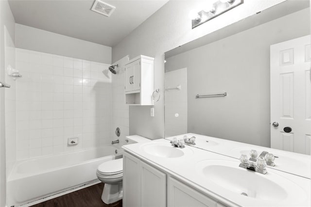 1600 Gretchen Dr, Cedar Park, TX 78613 - bathroom featuring wood finished floors, double vanity, and tub / shower combination