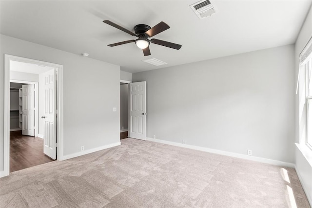 1600 Gretchen Dr, Cedar Park, TX 78613 - unfurnished bedroom featuring carpet, a spacious closet, and ceiling fan
