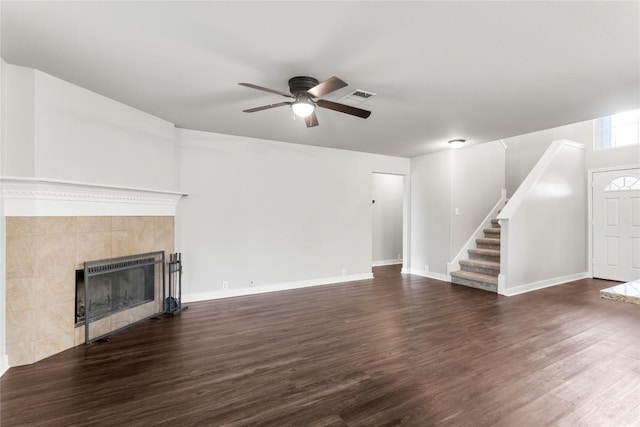 1600 Gretchen Dr, Cedar Park, TX 78613 - unfurnished living room with a ceiling fan, dark wood-style floors, stairs, and a fireplace
