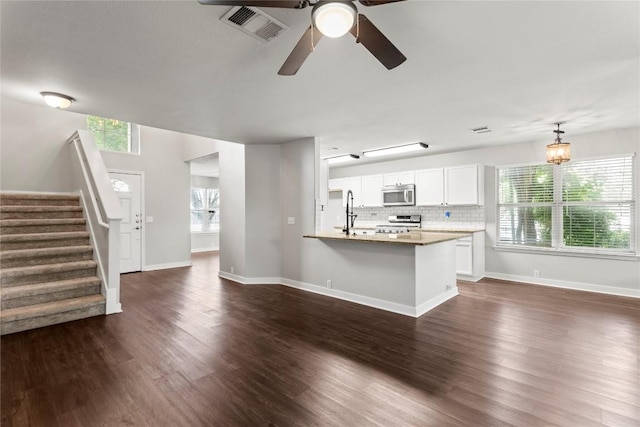 1600 Gretchen Dr, Cedar Park, TX 78613 - unfurnished living room with ceiling fan, dark wood-type flooring, stairs, and baseboards