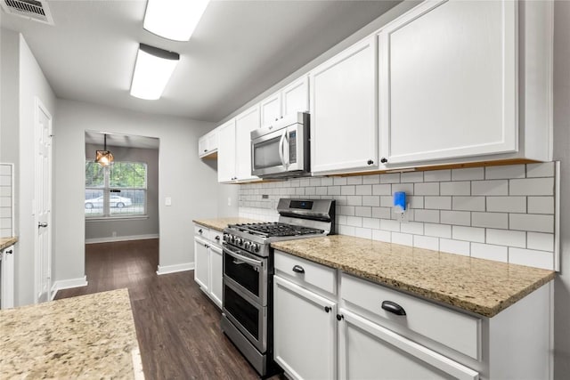 1600 Gretchen Dr, Cedar Park, TX 78613 - kitchen featuring stainless steel appliances, dark wood-type flooring, white cabinetry, backsplash, and baseboards