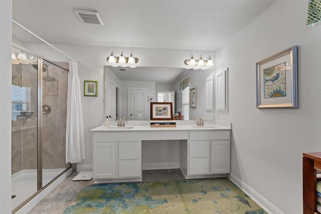 7609 Lazy Creek Dr, Austin, TX 78724 - bathroom with a stall shower, double vanity, and baseboards