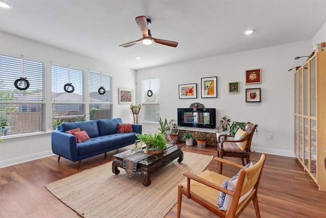 7609 Lazy Creek Dr, Austin, TX 78724 - living area featuring ceiling fan, wood finished floors, and recessed lighting