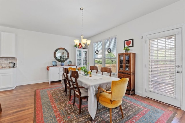 7609 Lazy Creek Dr, Austin, TX 78724 - dining space with a chandelier and wood finished floors