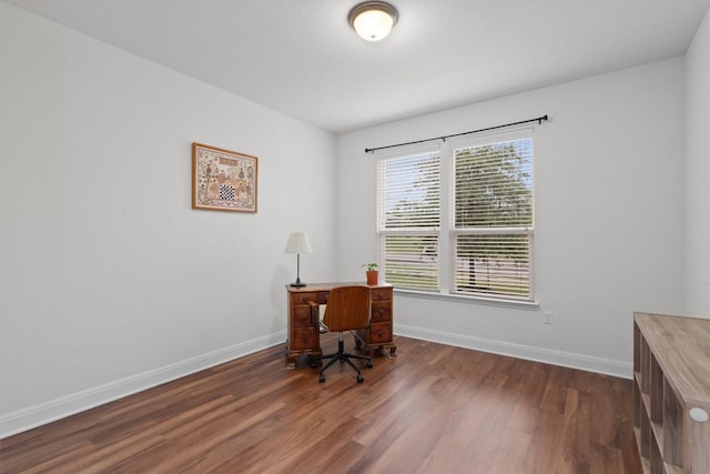 7609 Lazy Creek Dr, Austin, TX 78724 - office area featuring wood finished floors and baseboards