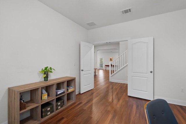 7609 Lazy Creek Dr, Austin, TX 78724 - hall featuring dark wood finished floors and stairway