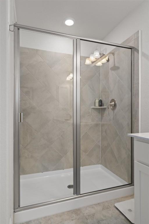 7609 Lazy Creek Dr, Austin, TX 78724 - full bath with a stall shower, vanity, and recessed lighting
