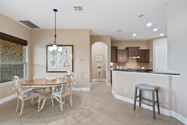937 Wild Rose Dr, Austin, TX 78737 - dining space with recessed lighting, light tile patterned floors, and baseboards