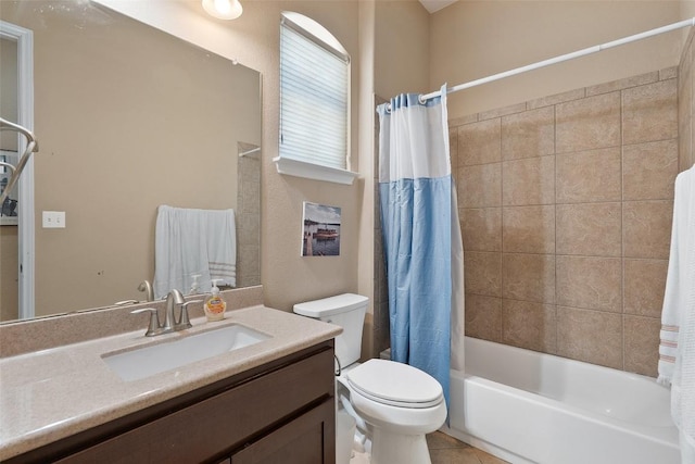 full bath with toilet, shower / bath combo, vanity, and tile patterned floors
