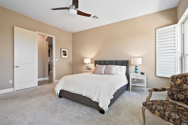 bedroom featuring carpet, baseboards, and a ceiling fan