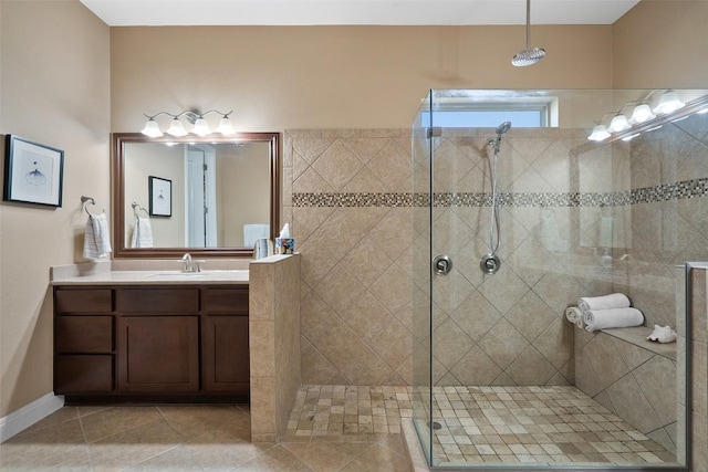 bathroom featuring a shower stall, tile patterned flooring, and vanity