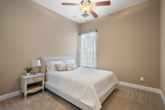 bedroom featuring light colored carpet, baseboards, and ceiling fan