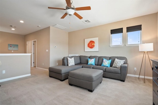 living area featuring light colored carpet, ceiling fan, baseboards, and recessed lighting