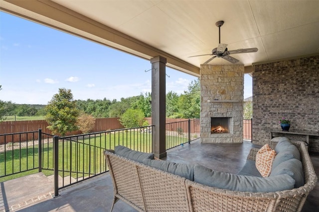 937 Wild Rose Dr, Austin, TX 78737 - view of patio with an outdoor stone fireplace and a ceiling fan