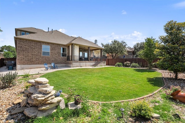 937 Wild Rose Dr, Austin, TX 78737 - rear view of property featuring a patio area, brick siding, and roof with shingles