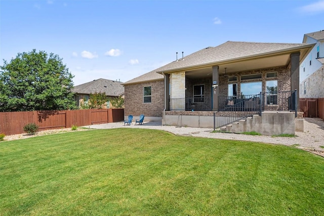 937 Wild Rose Dr, Austin, TX 78737 - back of house featuring a patio area and brick siding
