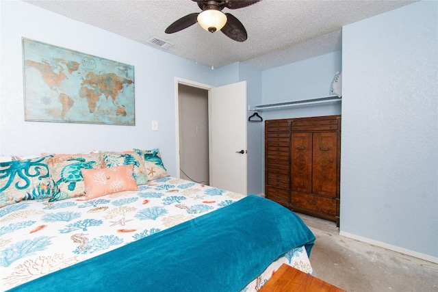 12 Catalpa Ct, Belton, TX 76513 - bedroom with ceiling fan, a textured ceiling, concrete flooring, and baseboards